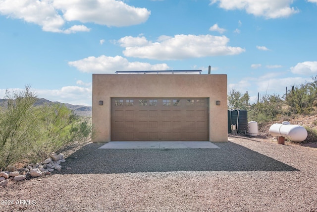 garage featuring a mountain view