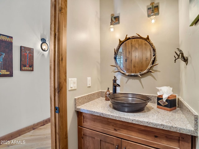 bathroom featuring vanity and wood-type flooring