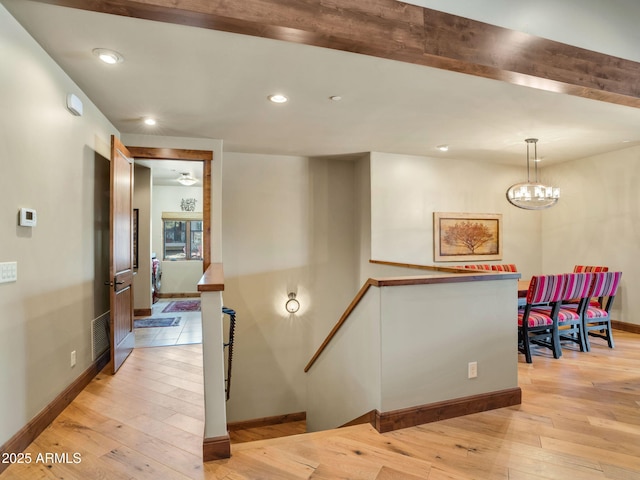 interior space with wood-type flooring and a chandelier