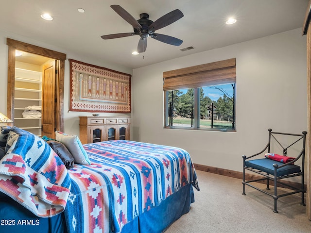 bedroom with light colored carpet and ceiling fan