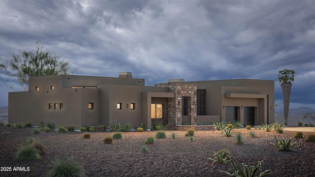 view of front of house featuring stucco siding