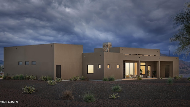 back of property with stucco siding