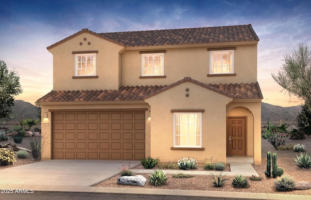 mediterranean / spanish-style house featuring a mountain view and a garage