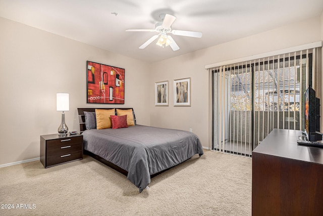 bedroom featuring access to exterior, ceiling fan, and light colored carpet