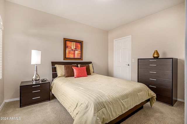 bedroom featuring light carpet