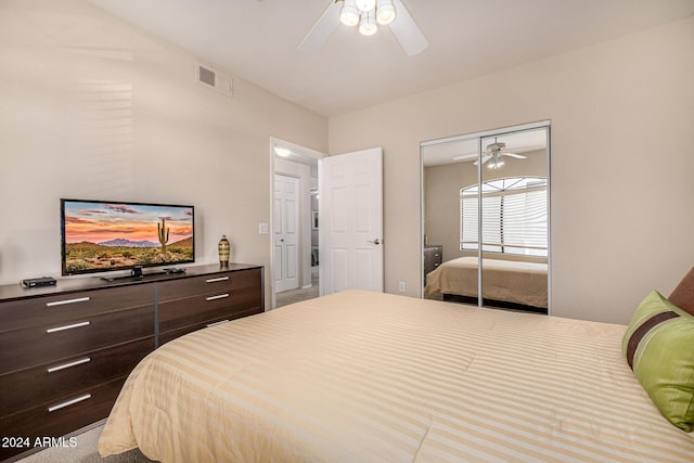 bedroom with ceiling fan and a closet