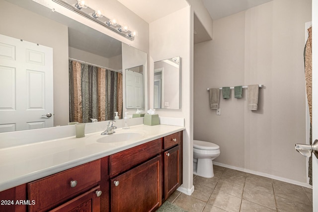 bathroom with tile patterned floors, vanity, and toilet