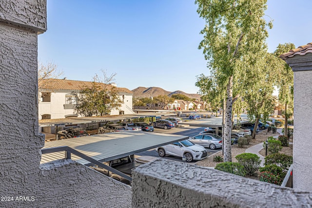 view of patio / terrace featuring a mountain view and a carport