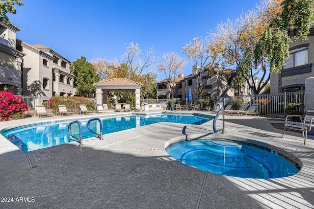 view of pool with a gazebo, a patio area, and a community hot tub