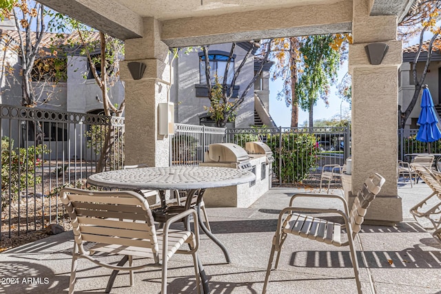 view of patio featuring grilling area and exterior kitchen