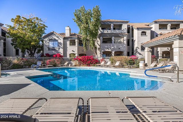 view of swimming pool with a patio