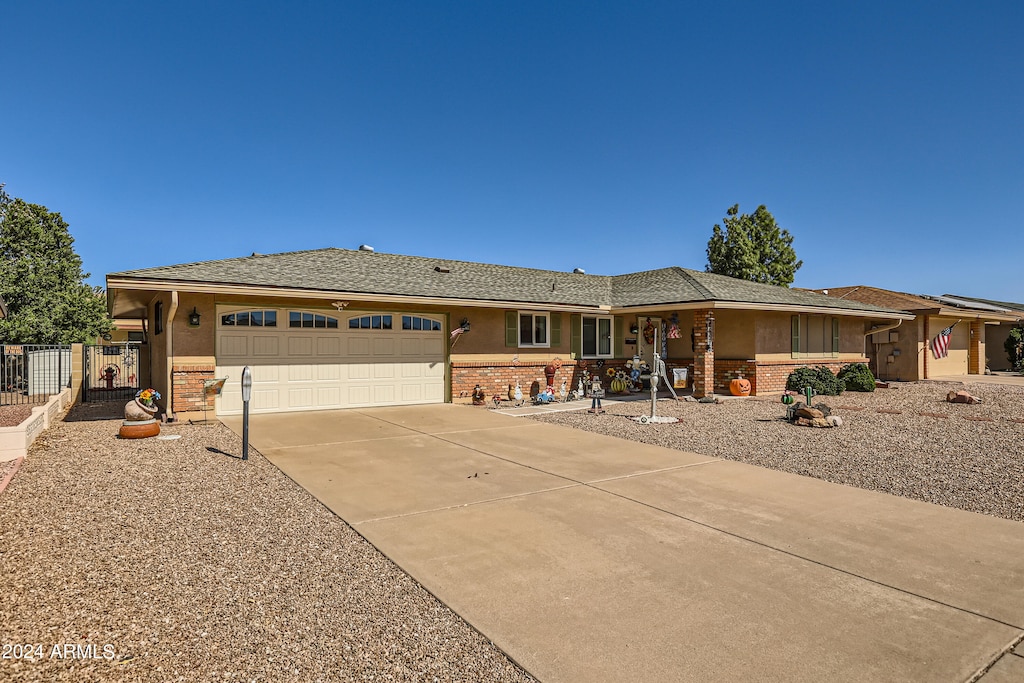 ranch-style house featuring a garage