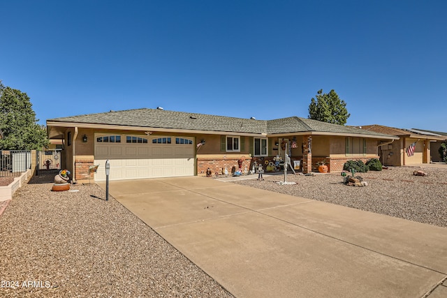 ranch-style house featuring a garage