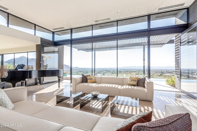 sunroom with a mountain view and plenty of natural light