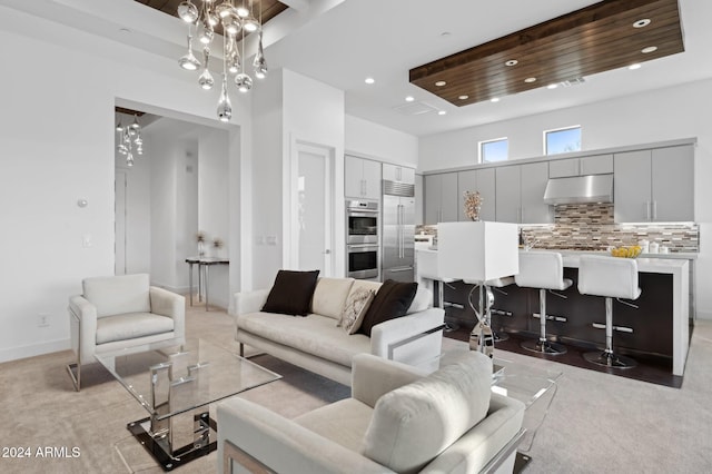 living room with a chandelier, a towering ceiling, and wooden ceiling