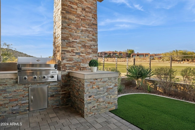 view of patio / terrace with a grill and area for grilling