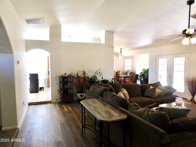 living room with french doors, dark hardwood / wood-style floors, and ceiling fan