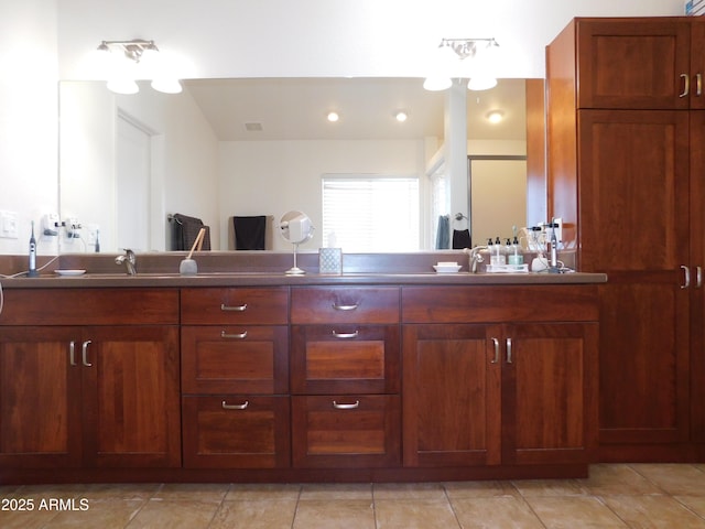 bathroom with vanity and tile patterned floors