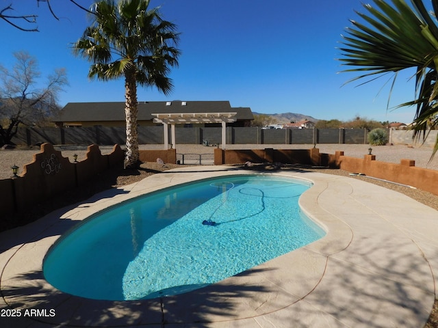 view of pool with a mountain view and a pergola