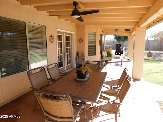 view of patio featuring french doors and ceiling fan