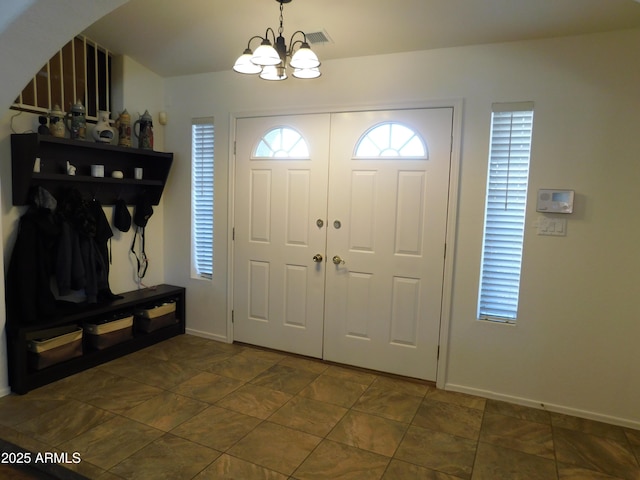 entrance foyer featuring a notable chandelier