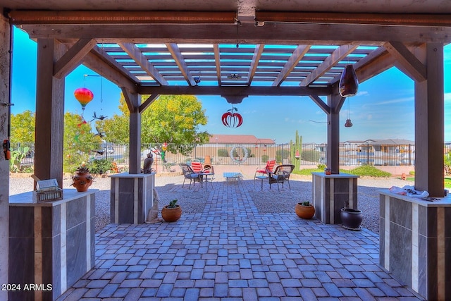 view of patio featuring a pergola