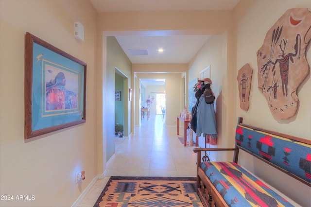 corridor with light tile patterned floors