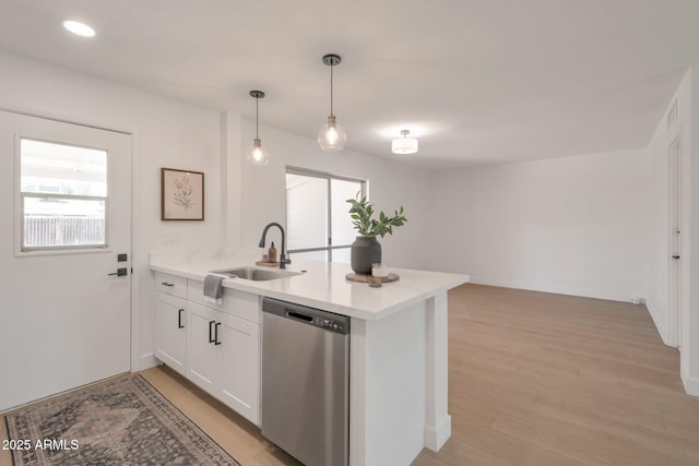1051 E Millett Ave, Mesa, AZ 85204 - kitchen featuring stainless steel dishwasher, a peninsula, light wood-style flooring, light countertops, and recessed lighting