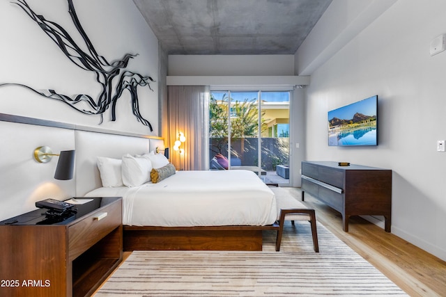 bedroom featuring hardwood / wood-style floors