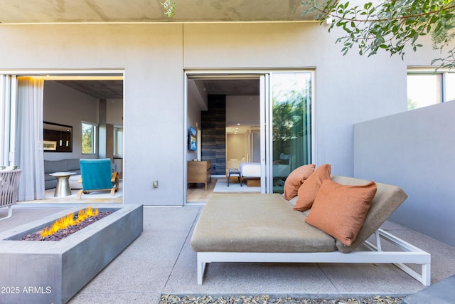 view of patio with a fire pit