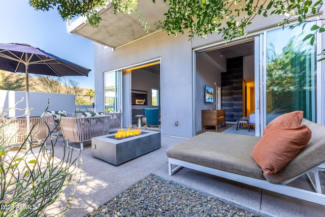 view of patio / terrace featuring an outdoor fire pit