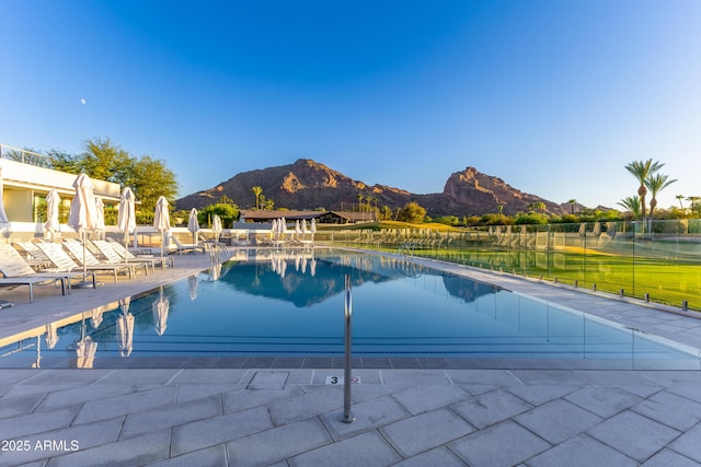 view of pool featuring a mountain view and a patio area