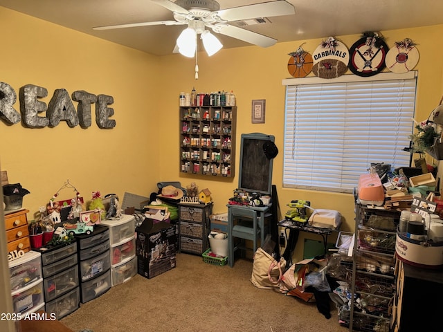 interior space featuring visible vents and ceiling fan