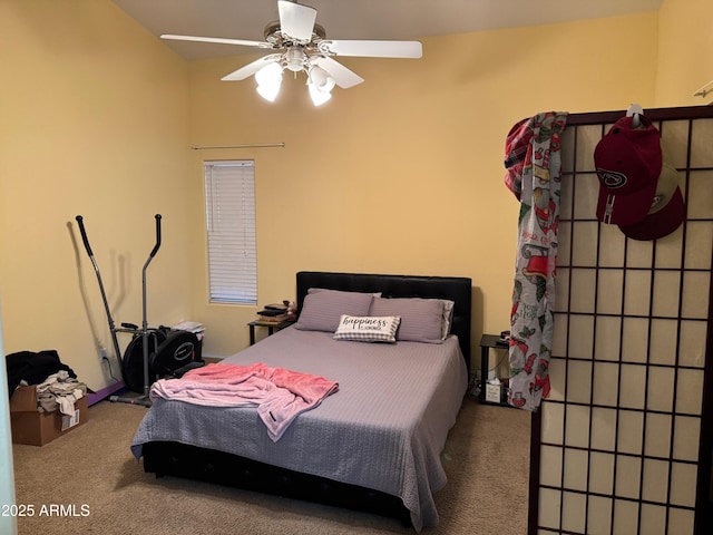 bedroom featuring a ceiling fan and carpet