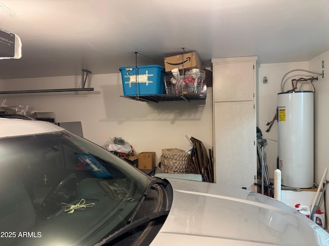 garage featuring a garage door opener and water heater