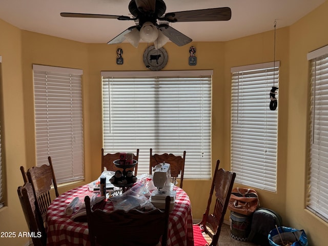 dining space featuring ceiling fan