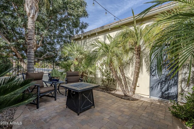 view of patio with an outdoor fire pit