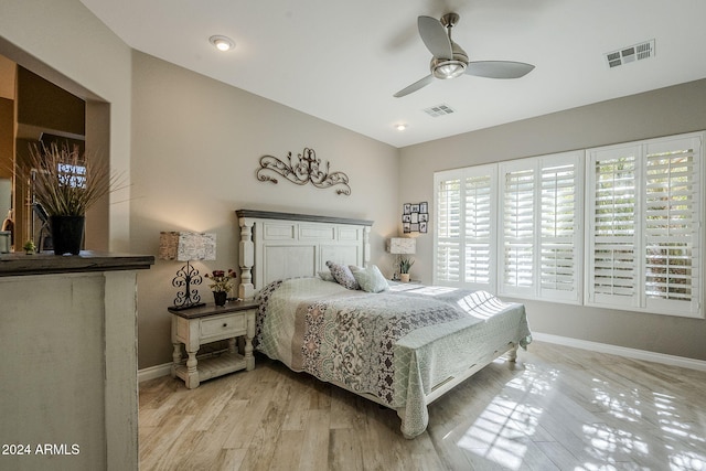 bedroom with light wood-type flooring and ceiling fan