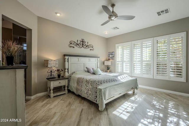 bedroom with ceiling fan and light hardwood / wood-style floors