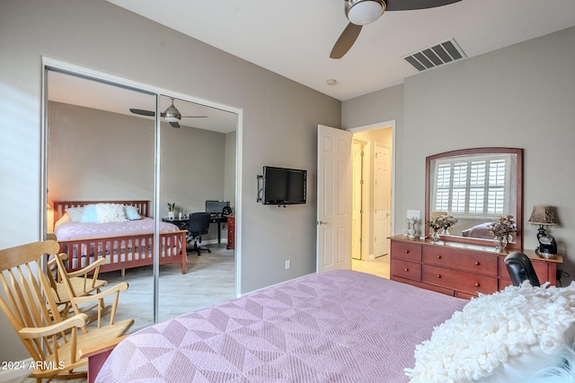 bedroom with ceiling fan and a closet