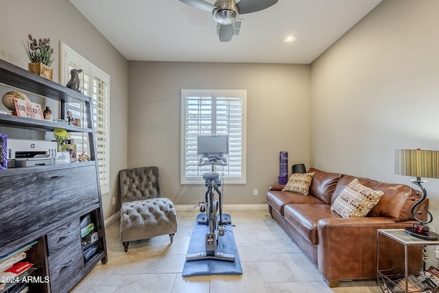 interior space featuring light tile patterned floors and ceiling fan