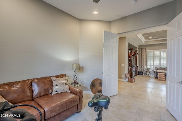 living room with a tray ceiling