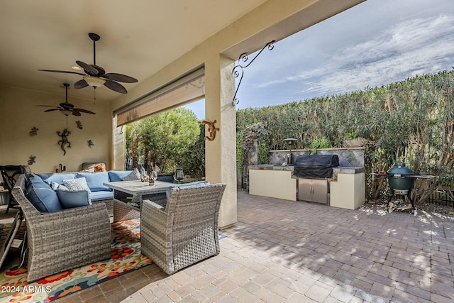 view of patio / terrace featuring ceiling fan, area for grilling, and an outdoor living space