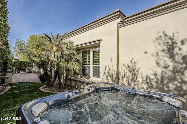 exterior space featuring a jacuzzi