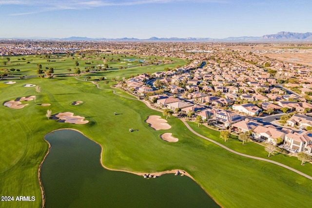 drone / aerial view with a water and mountain view