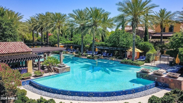 view of pool with a pergola and a patio area