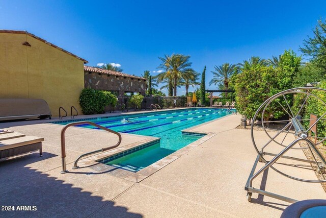 view of pool featuring a patio and area for grilling