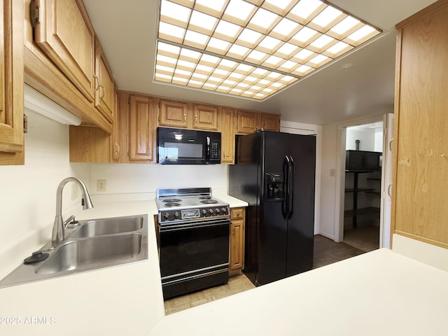 10330 W Thunderbird Blvd Unit C304, Sun City, AZ 85351 - kitchen with black appliances, light countertops, and a sink
