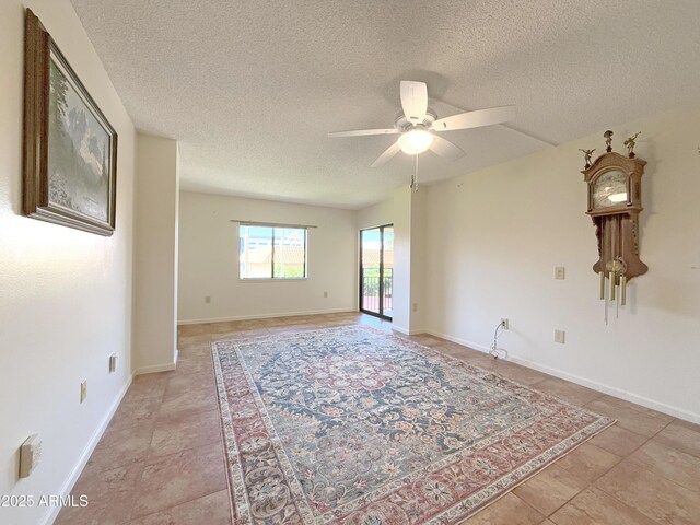 10330 W Thunderbird Blvd Unit C304, Sun City, AZ 85351 - empty room featuring baseboards, ceiling fan, and a textured ceiling