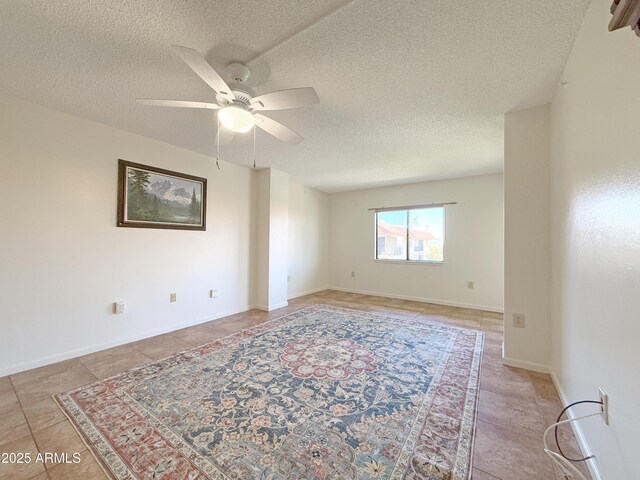 10330 W Thunderbird Blvd Unit C304, Sun City, AZ 85351 - spare room featuring a textured ceiling, ceiling fan, and light tile patterned flooring
